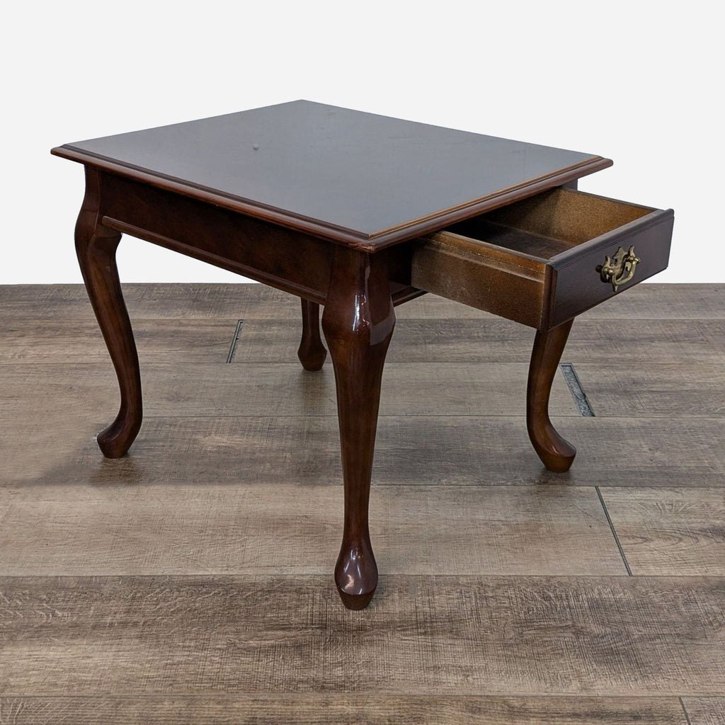 a small, antique, antique, mahogany table with a drawer.