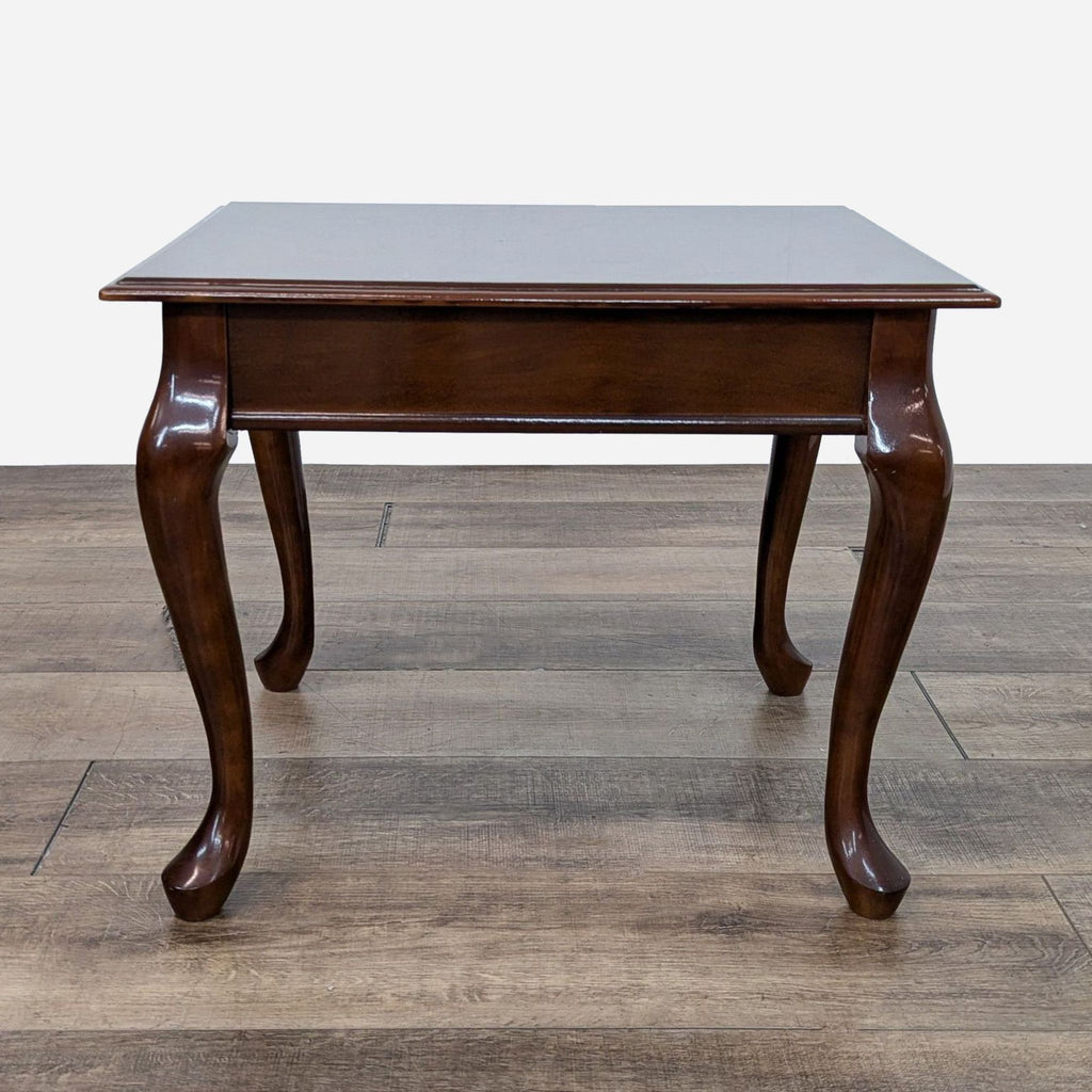 a mahogany table with a dark brown top and a dark brown table top.