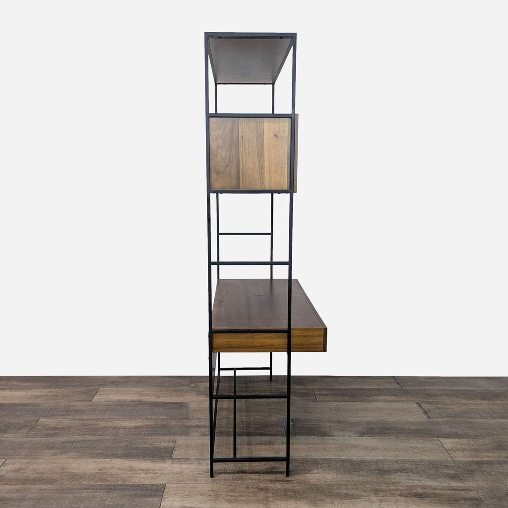 a tall metal and wood shelf unit with a black metal base.