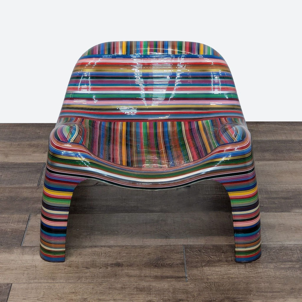 a chair made of plastic, with a striped seat.