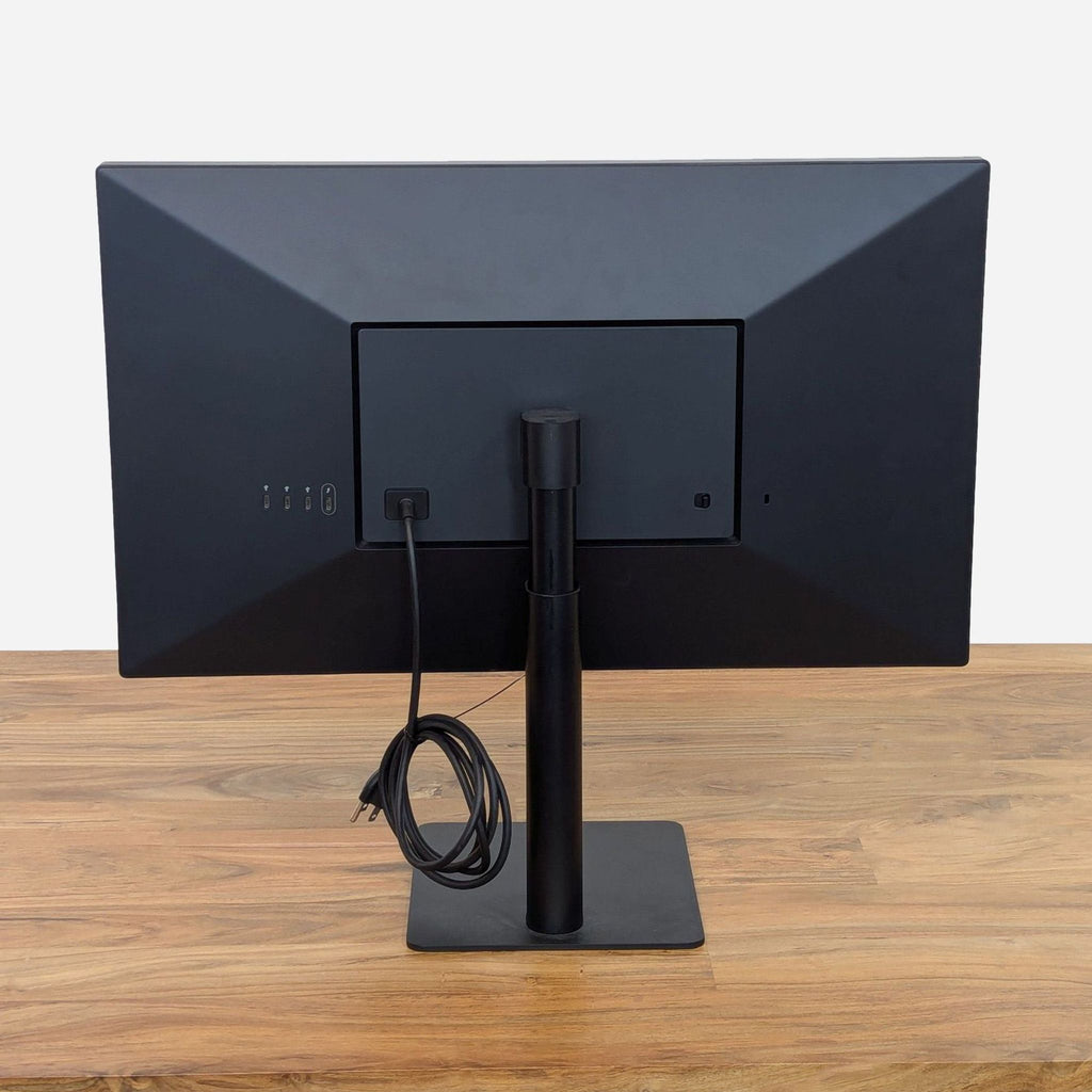 the monitor is a simple, modern design that can be used as a desk.