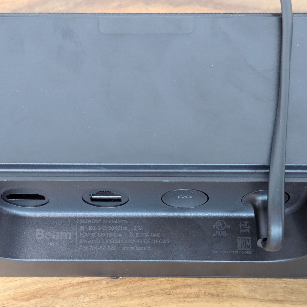 the back of the console has a cable that connects the controller to the console.