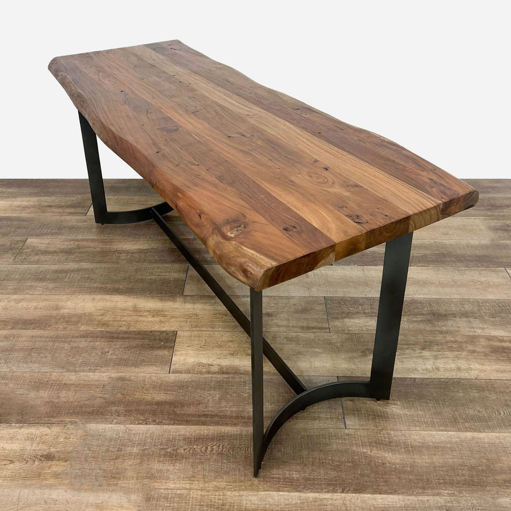 a large industrial walnut and black walnut table