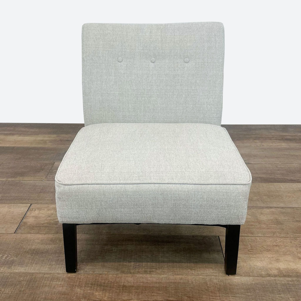 a pair of grey upholstered chairs