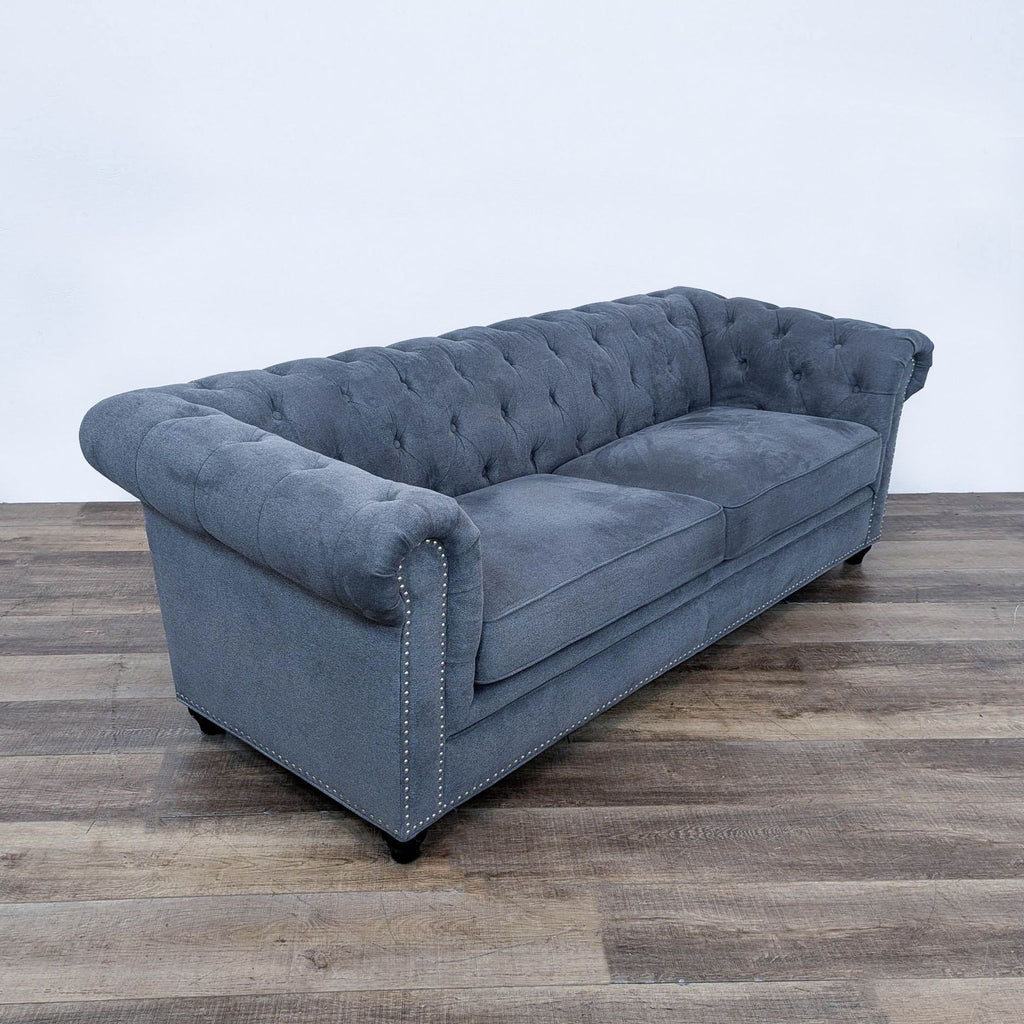 the gray velvet tufted sofa