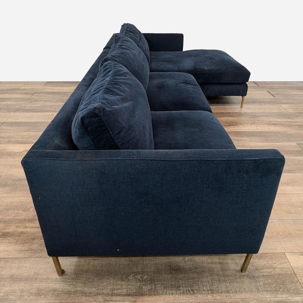 a pair of blue velvet sofas in the manner of [ unused0 ]