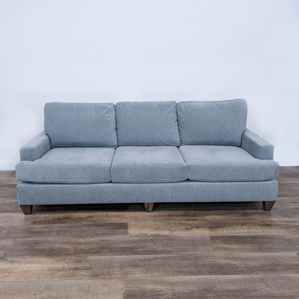 sofa is a modern sofa that is made from a single piece of fabric. the sofa is made