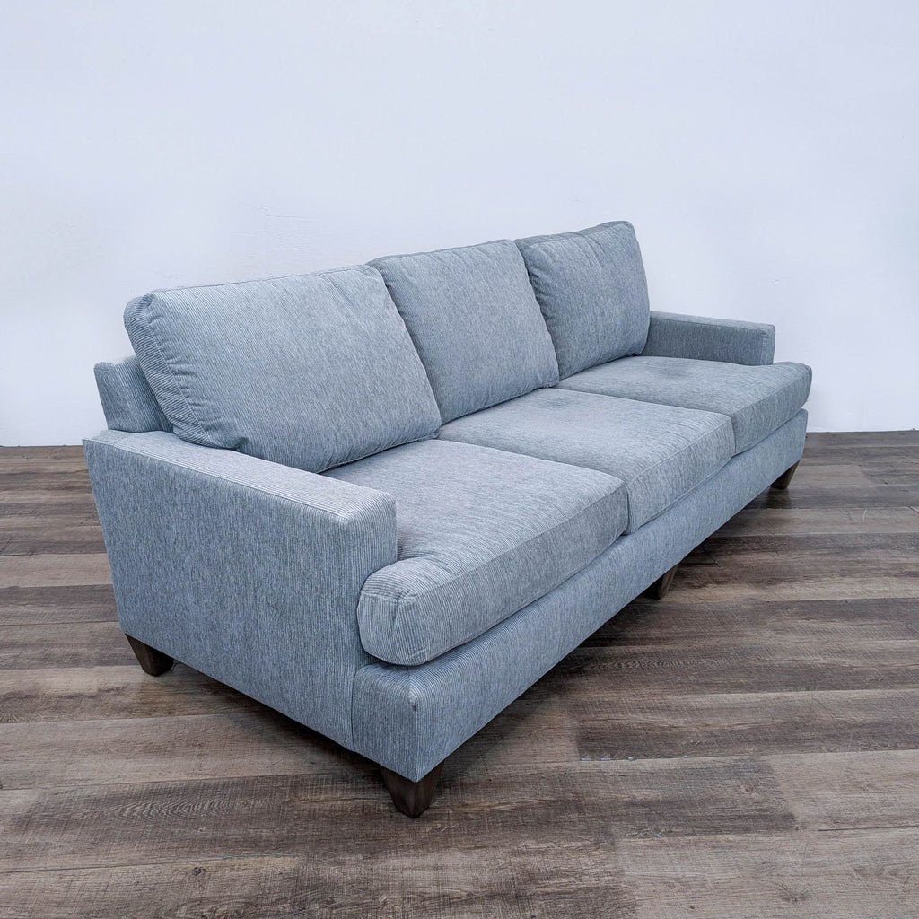 sofa is a modern sofa that is made from a single piece of fabric. the sofa is made