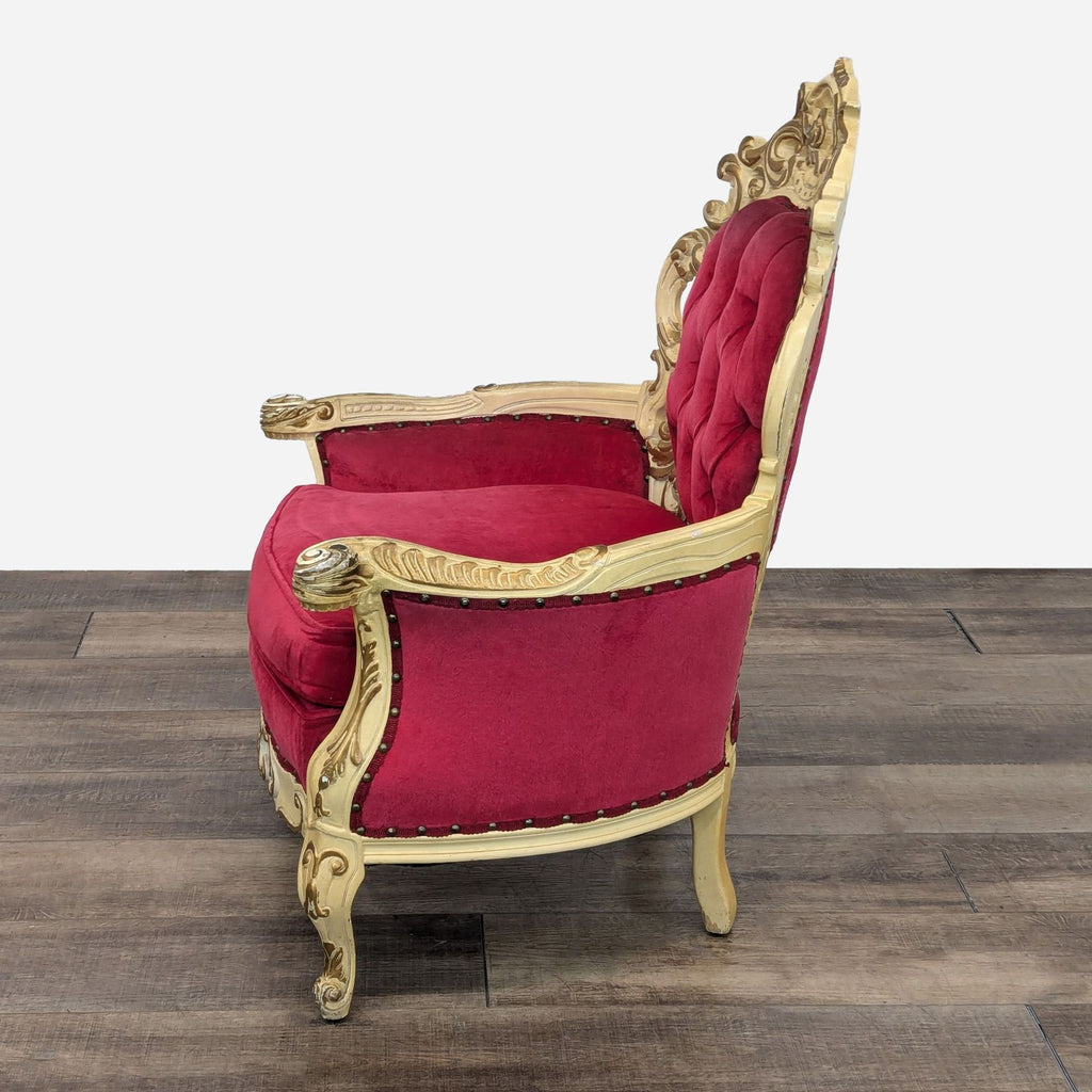 a red velvet and gold chair