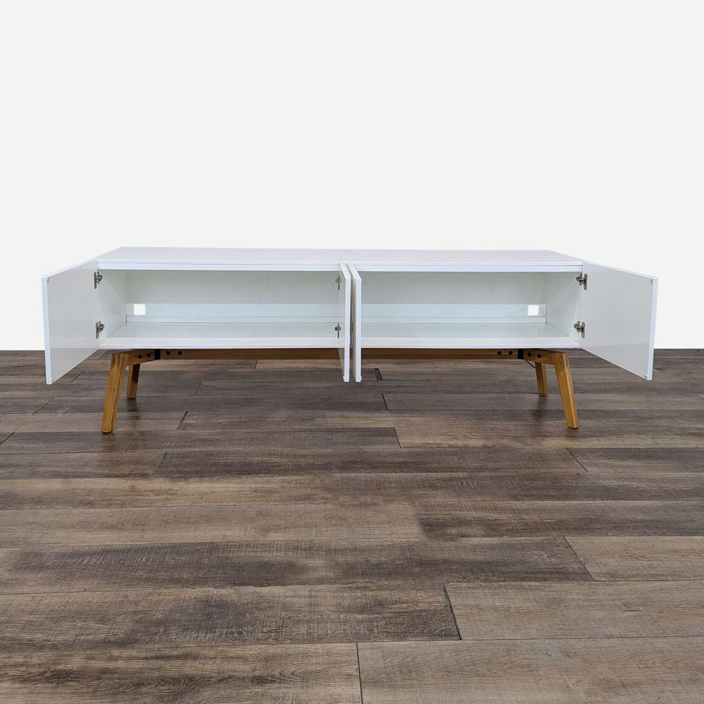 the coffee table is made from a white lacquered wood with a white top and a wooden