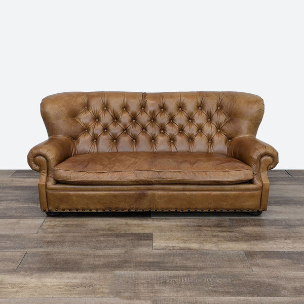 Churchill sofa by Restoration Hardware, featuring a tufted back and clubby look, shown from the front.