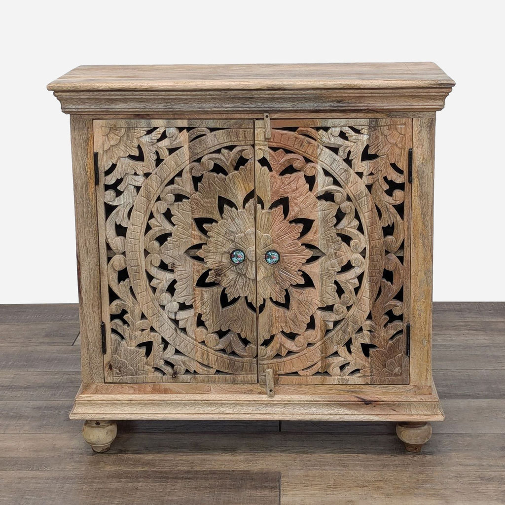 a wooden chest with a floral design