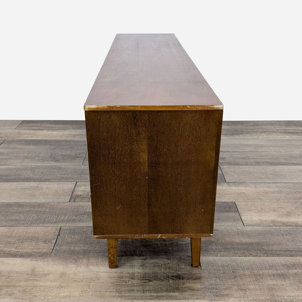 a mid century modern walnut side table