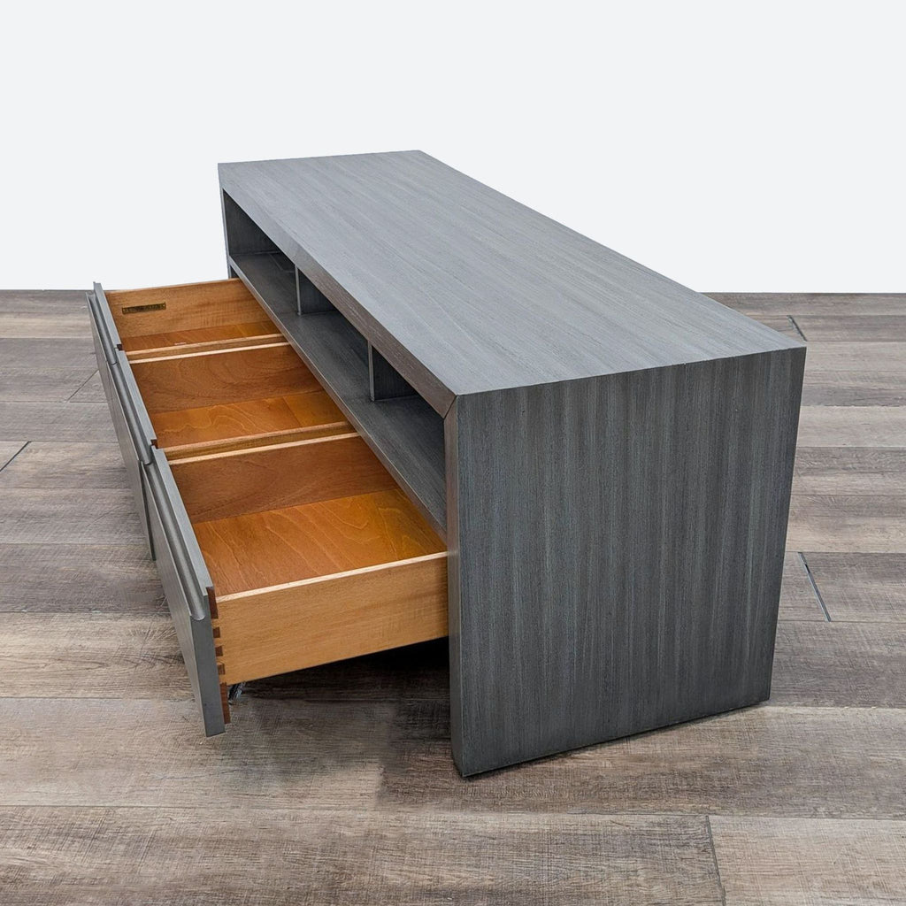 the [ unused0 ] coffee table is made from a steel and wood veneer.