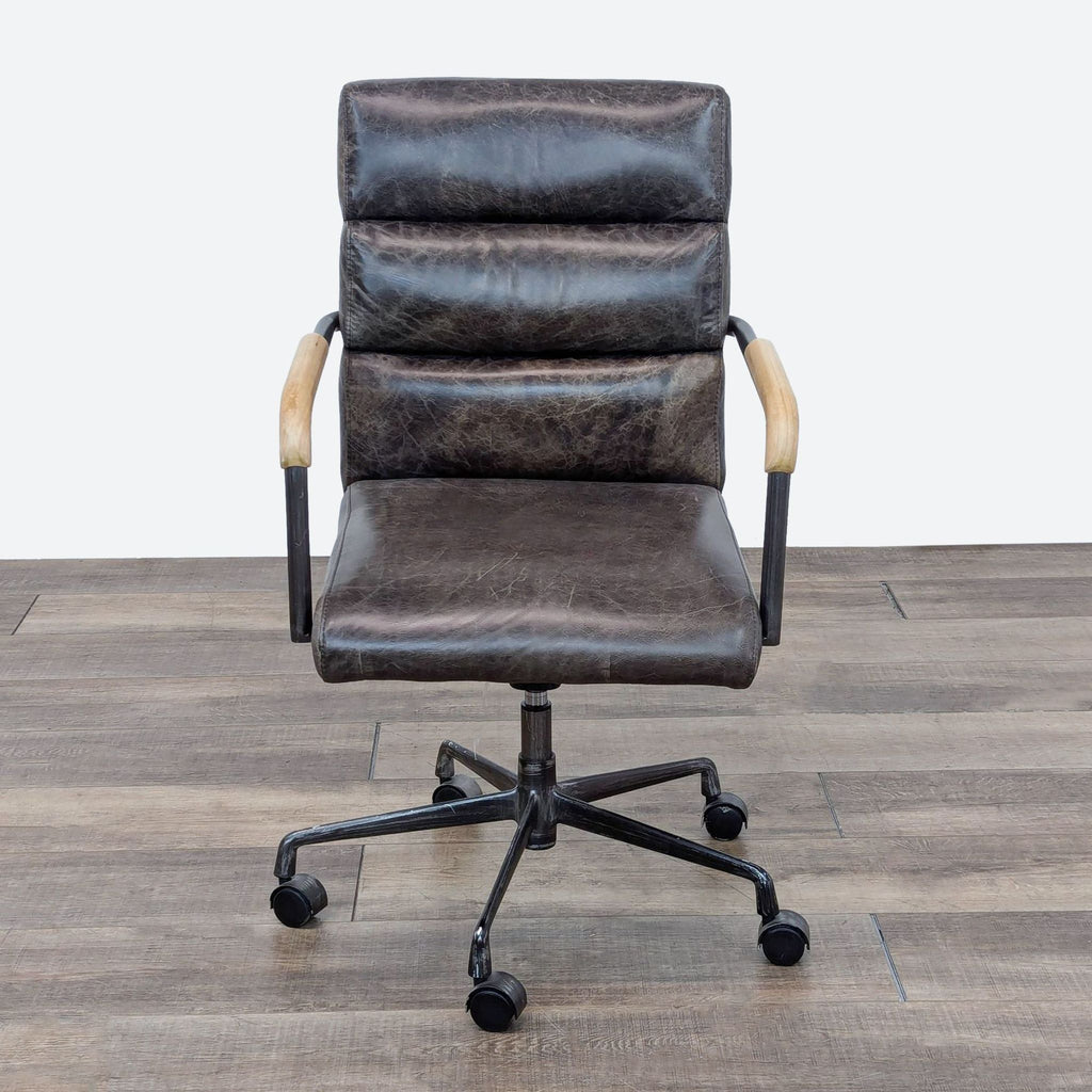 vintage office chair with a leather frame and a black leather base.