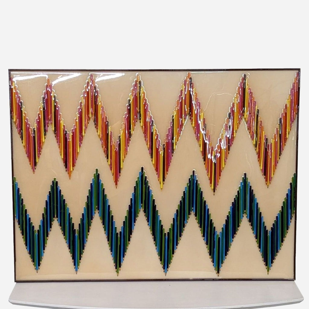 a large, hand - painted glass plate by [ unused0 ].