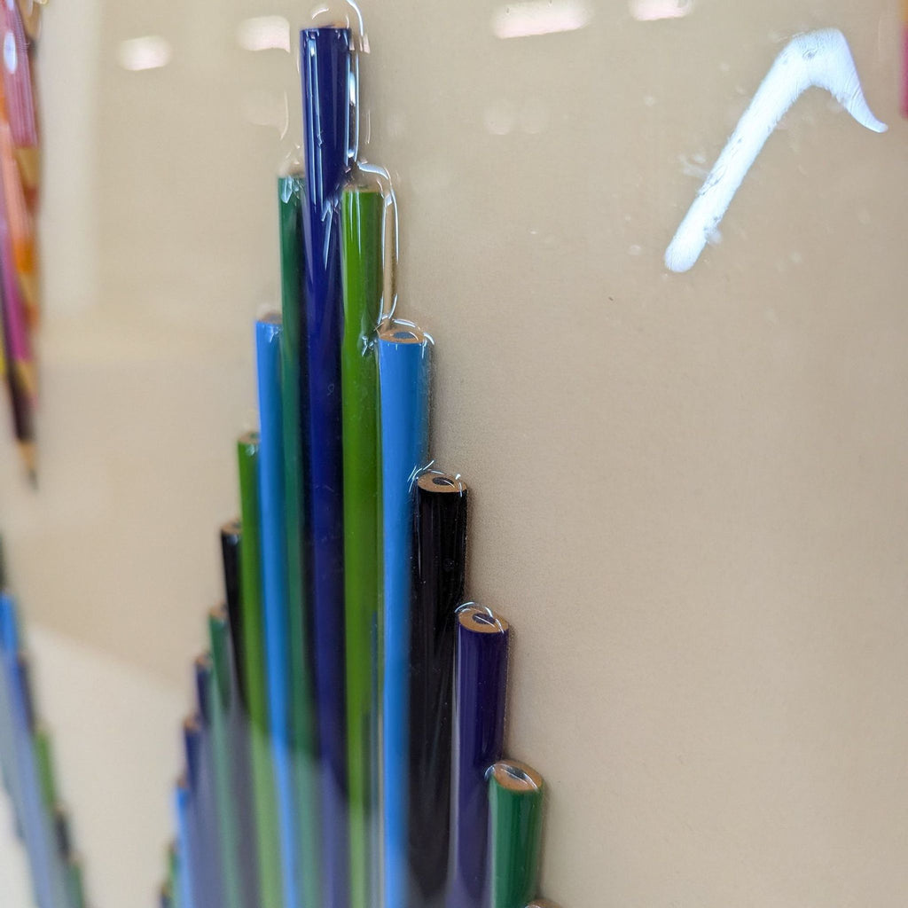 a close up of a glass sculpture with a blue and green design.