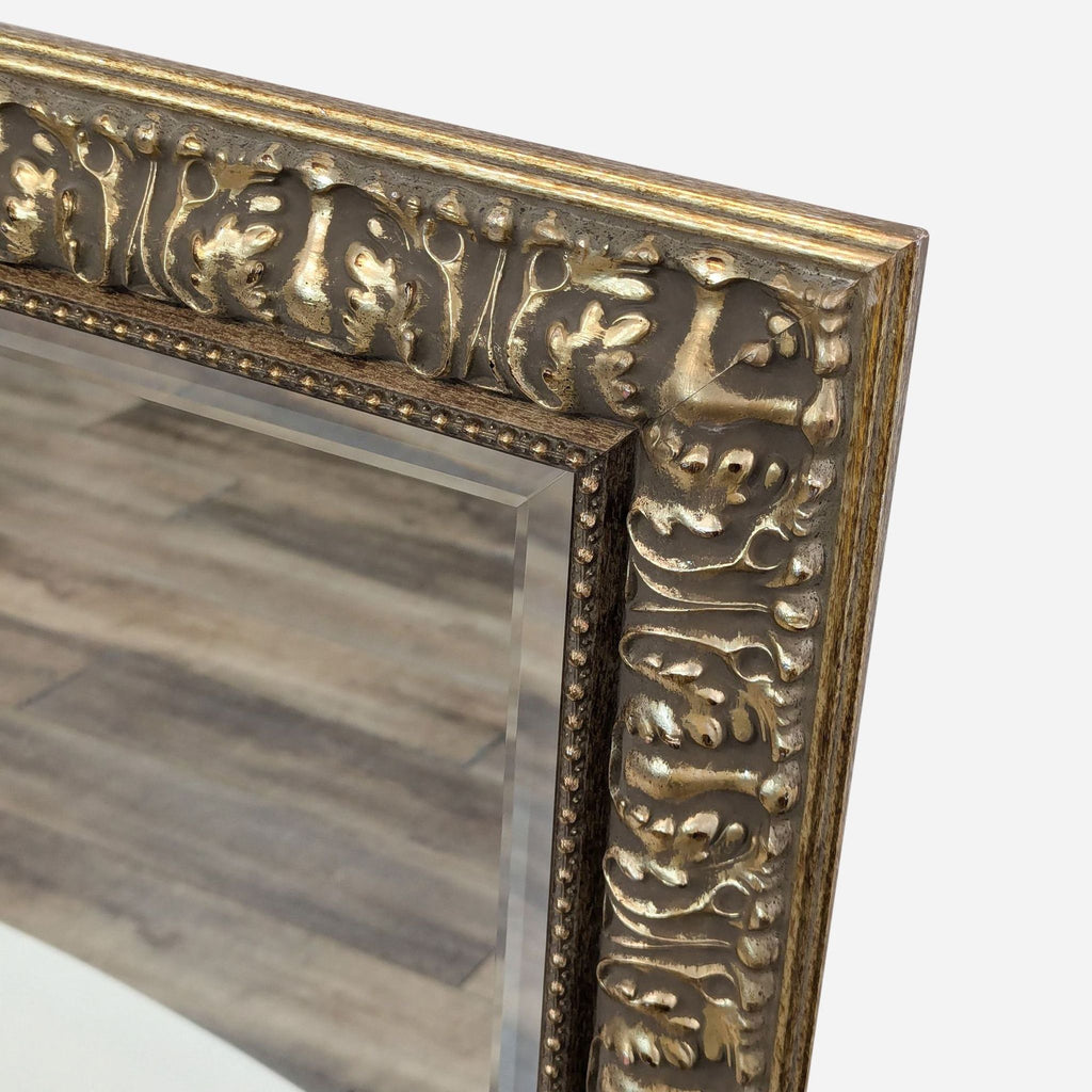 a large antique gold mirror with a carved frame for sale