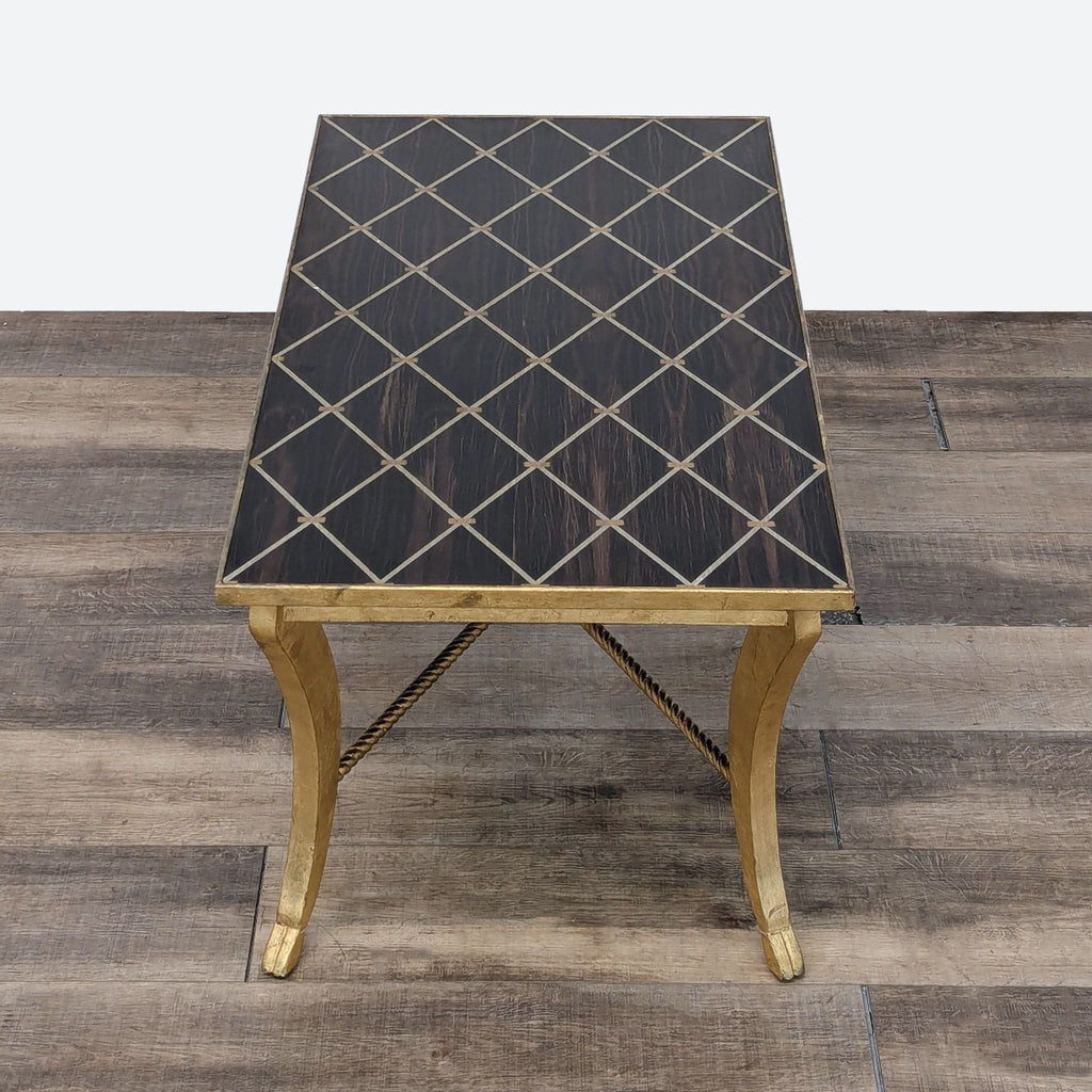 the table is made of a black and gold metal base.