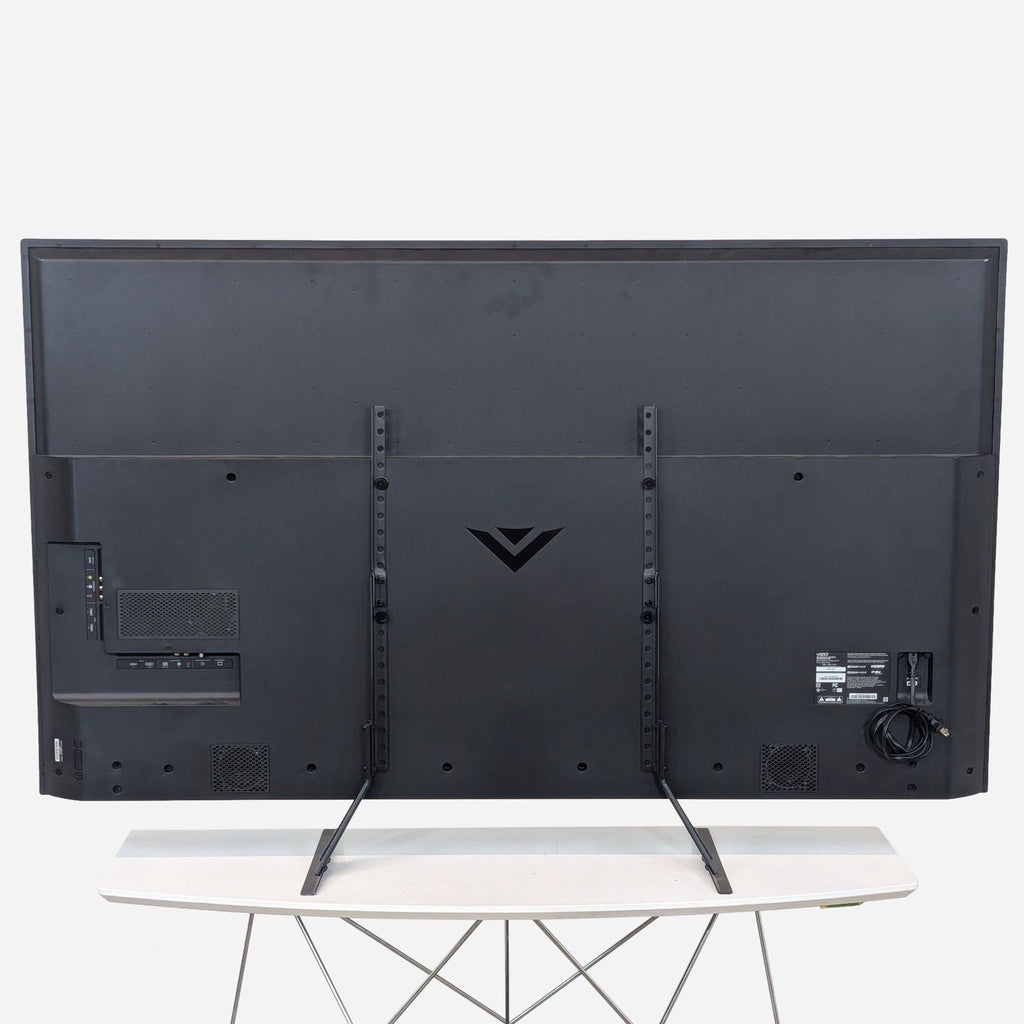 the rear view of the tv is a black metal frame with a white background.