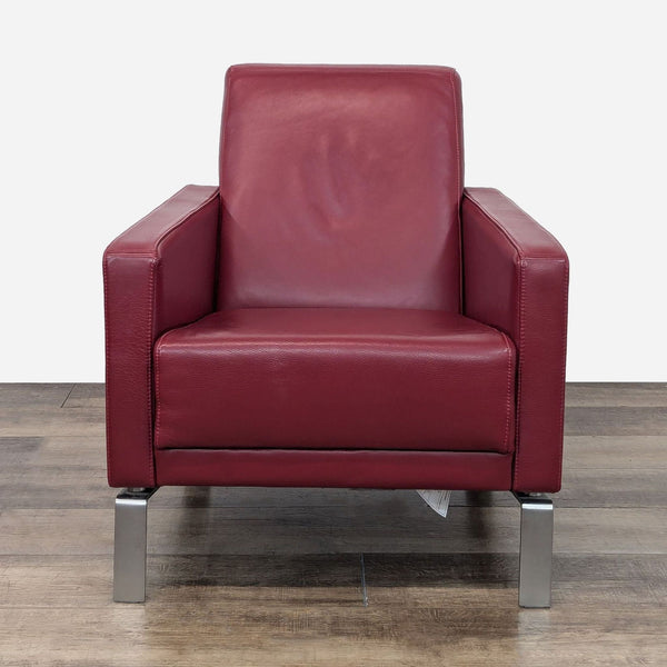 a modern red leather chair with chrome legs