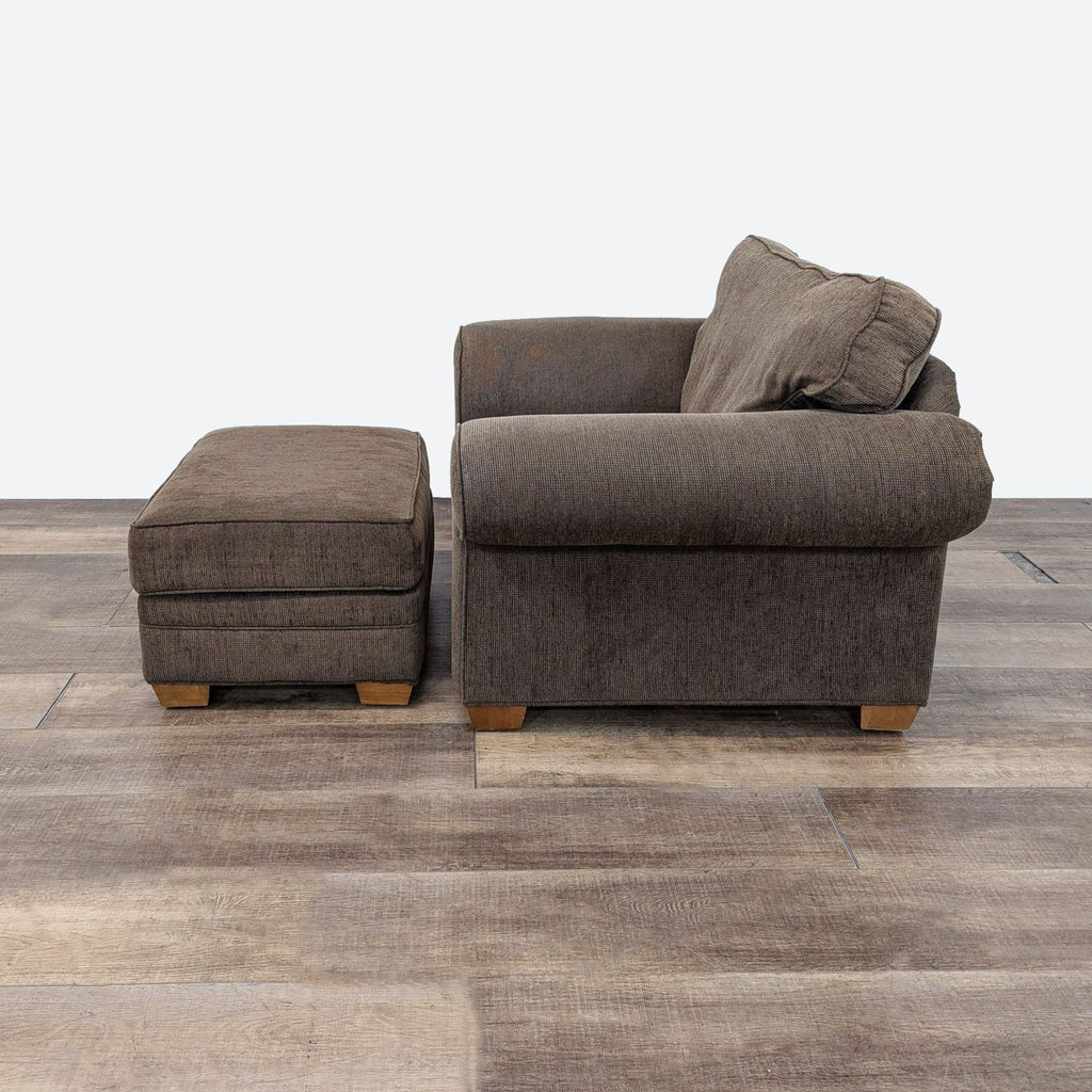 a brown chair and ottoman in a room.