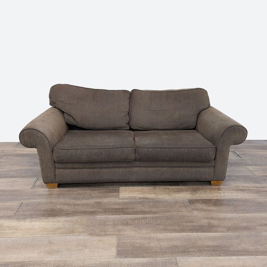 a brown sofa with a wooden base in a room. 3d rendering