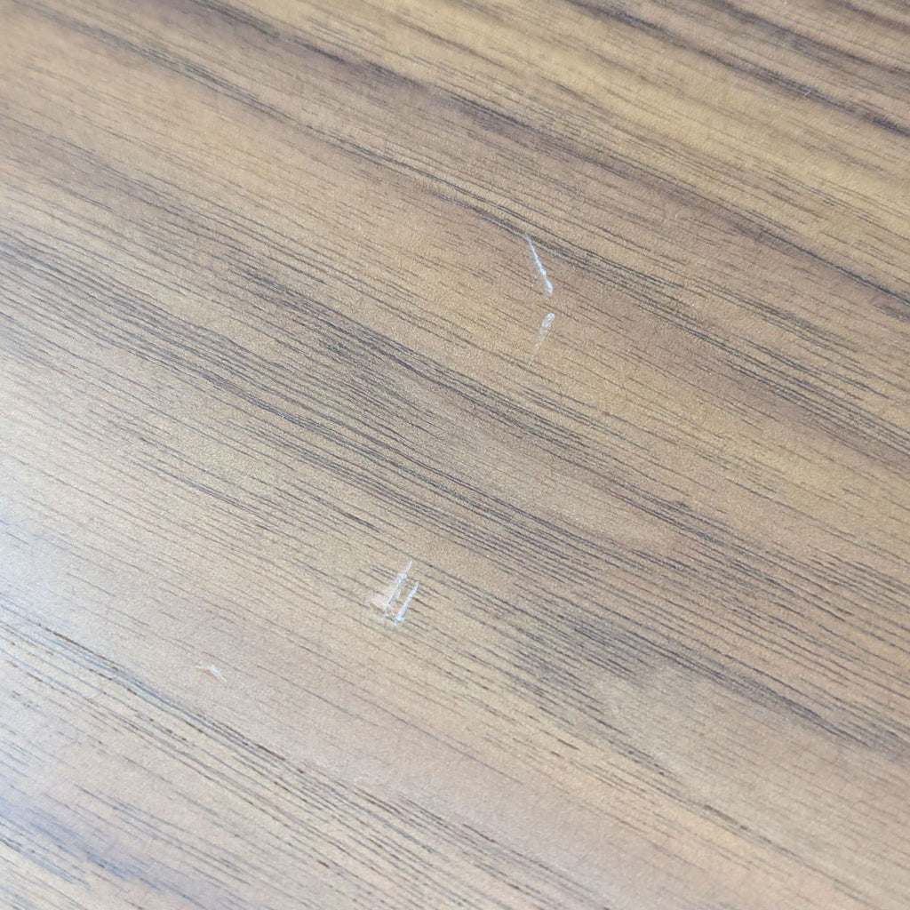 a close up of a wood table with a white stain.