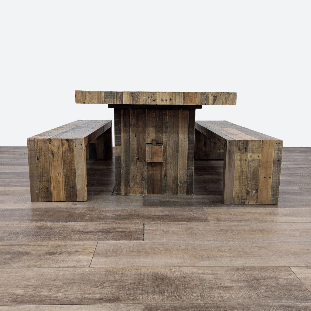 a large, rustic, rustic, wooden table with two benches.