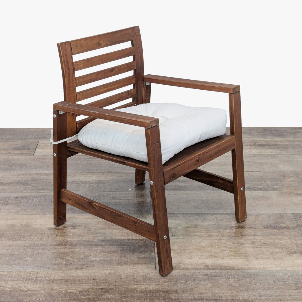 the chair is made of solid wood and has a white cushion.