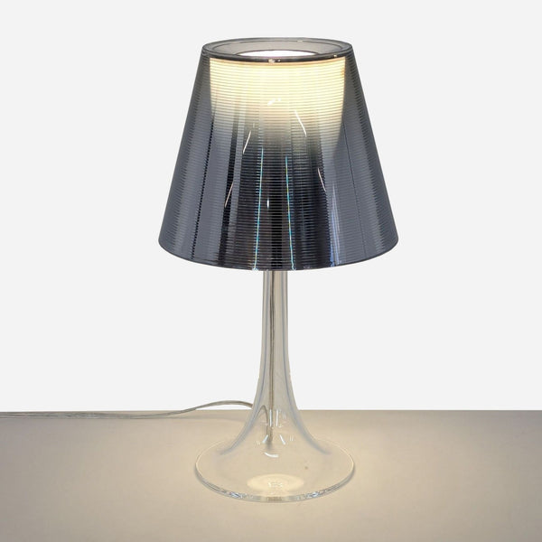 a table lamp with a glass shade