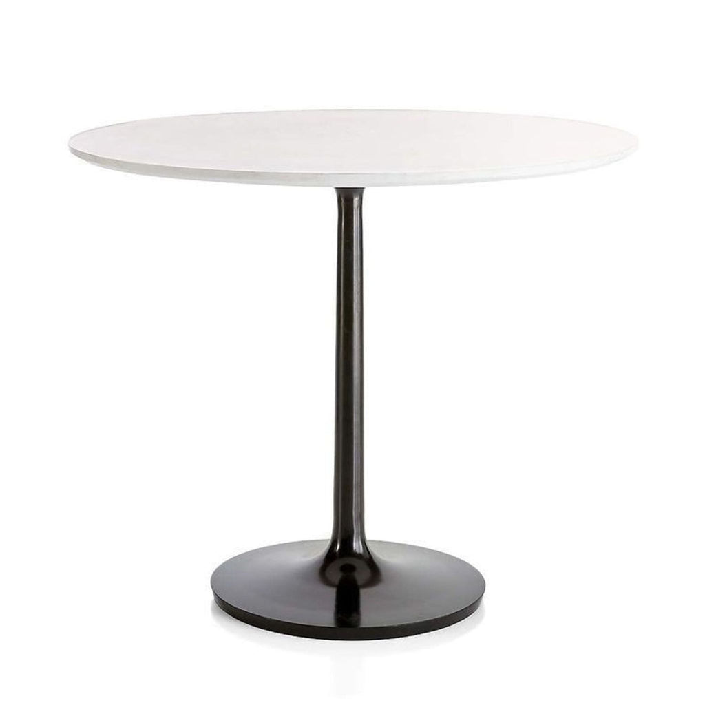 the round table is a modern, minimalist design with a black base.