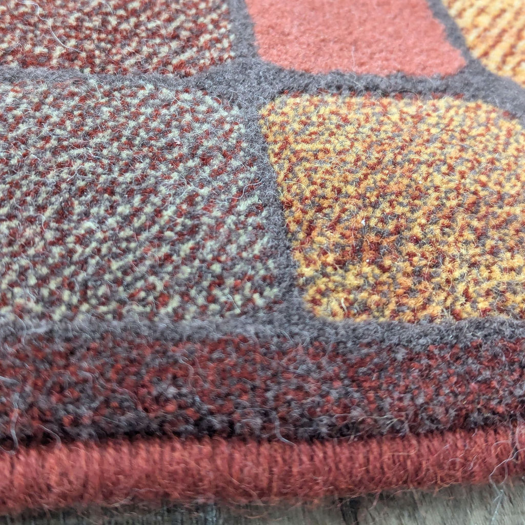 a close up of a multicolored rug