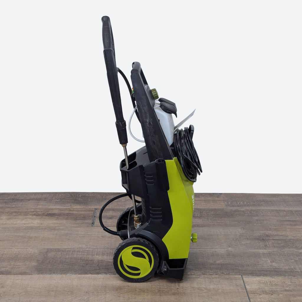 a vacuum cleaner on a wooden table.