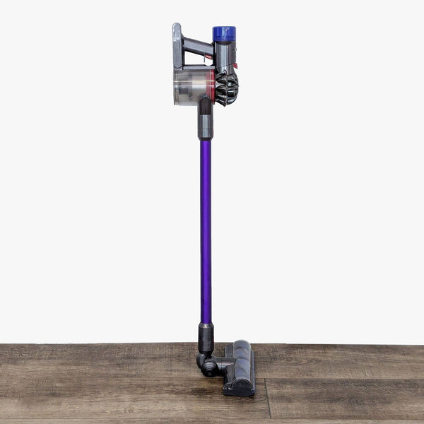 a blue and purple floor mop with a purple handle