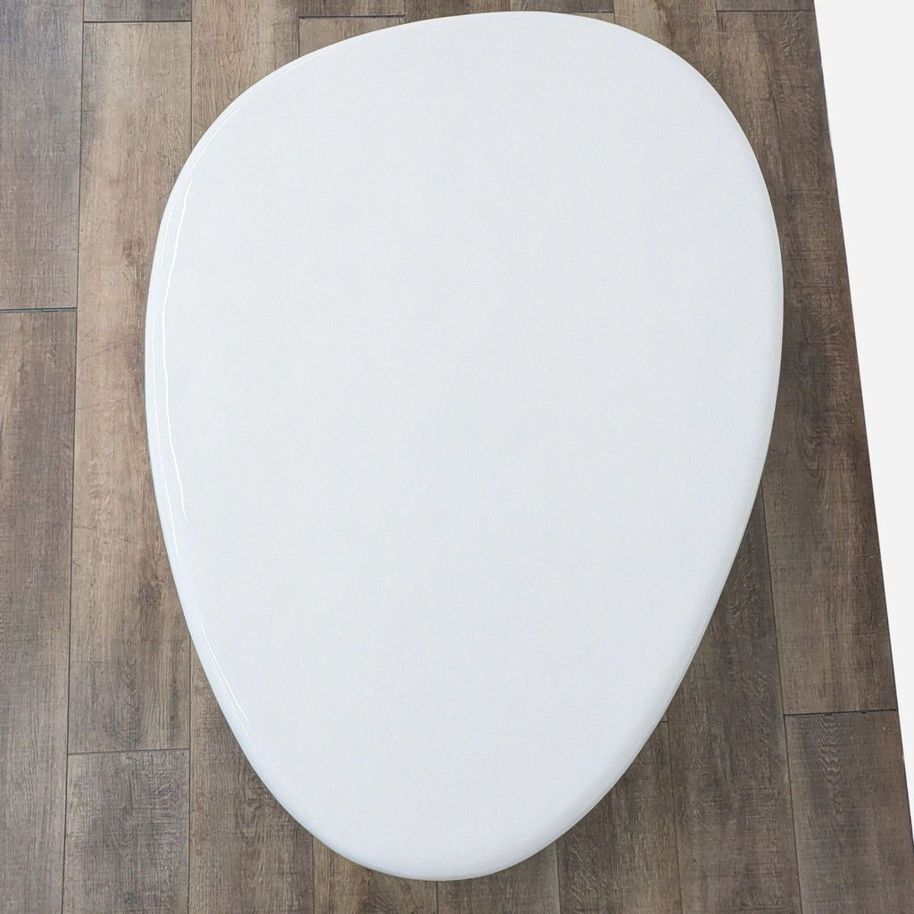 CB2 Alastor Oval High Gloss White Concrete Coffee Table