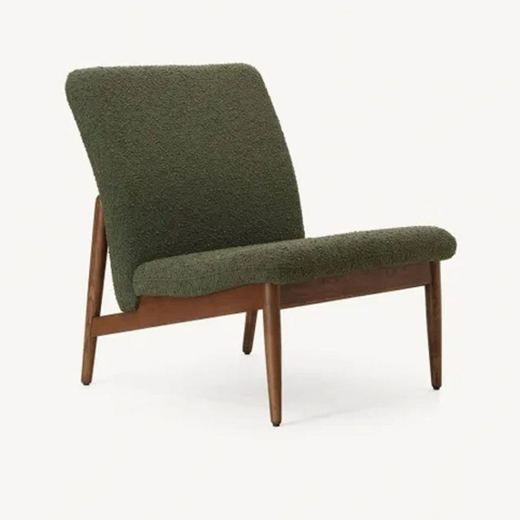 a chair with a green fabric upholstery.