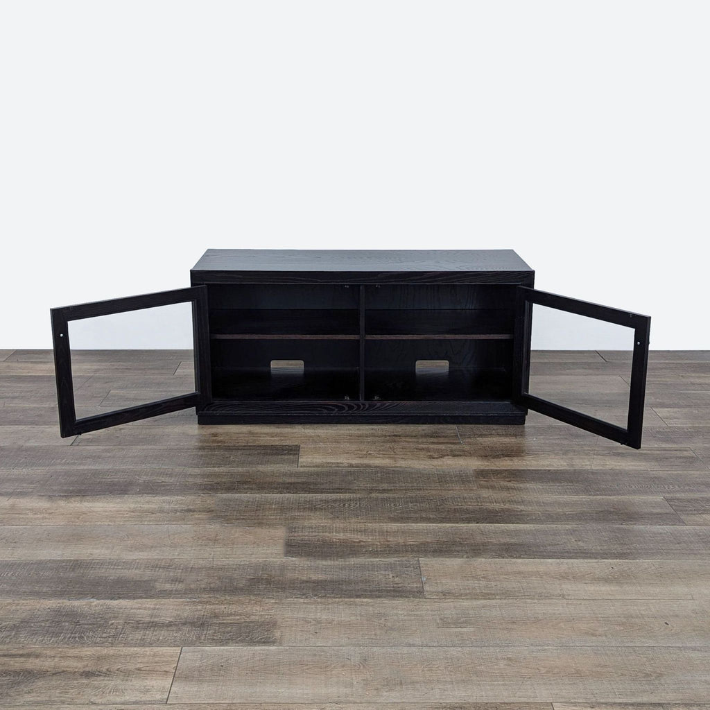 a black coffee table with two shelves.