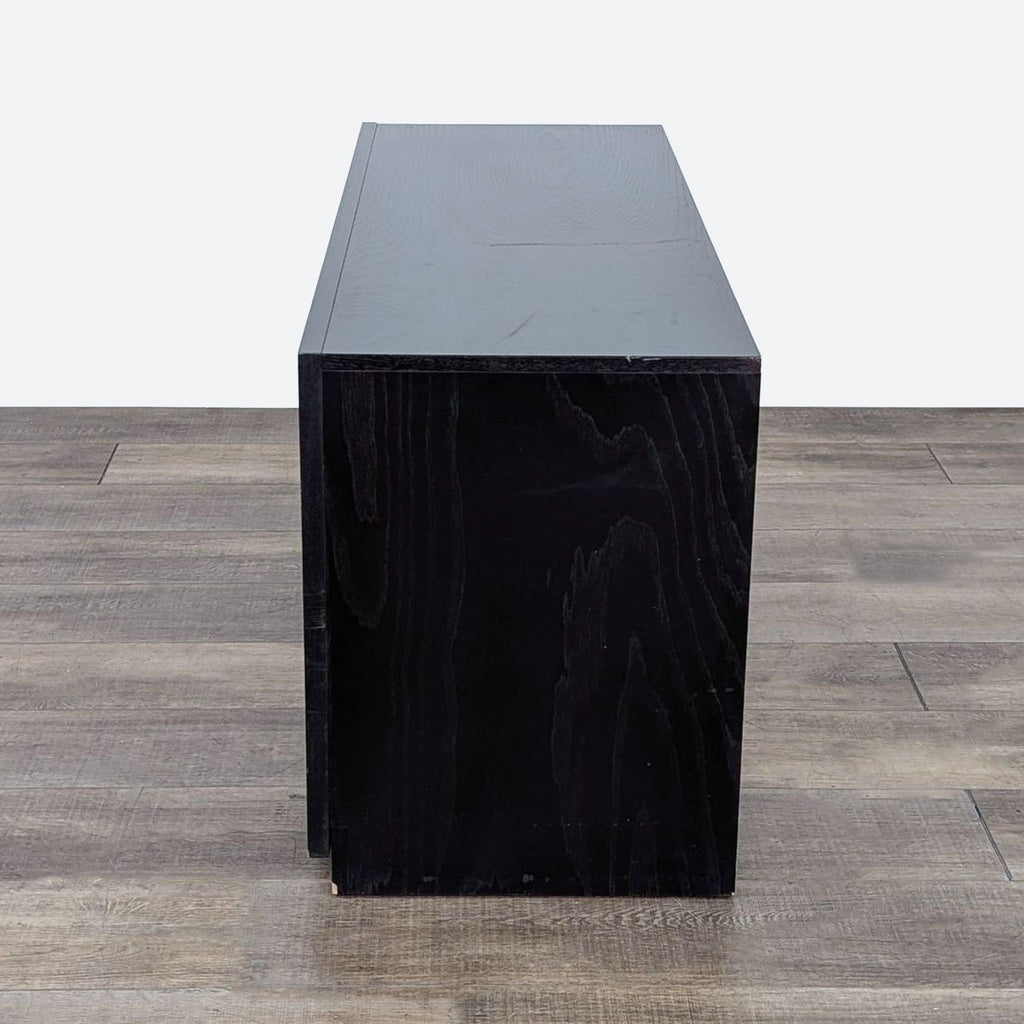 a black wooden box with a black top.