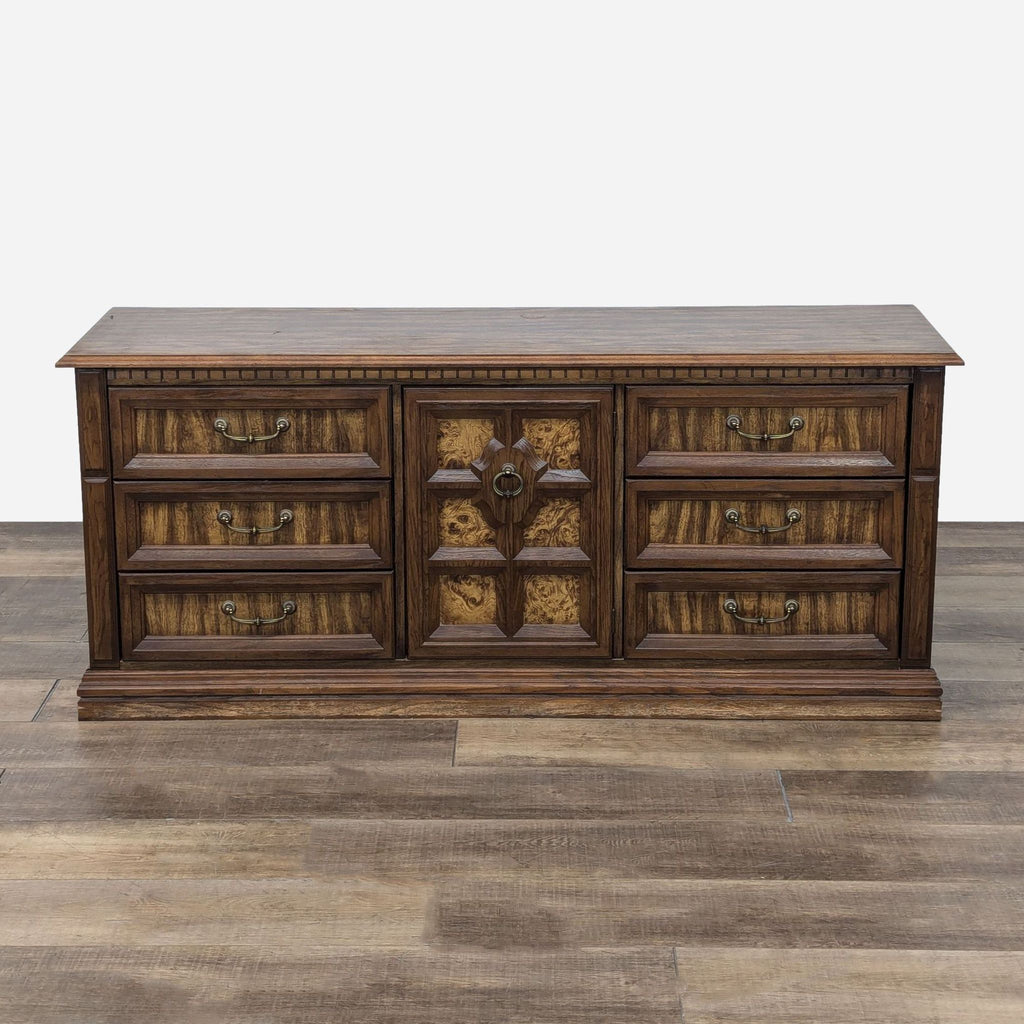 a large, antique, oak, chest of drawers.