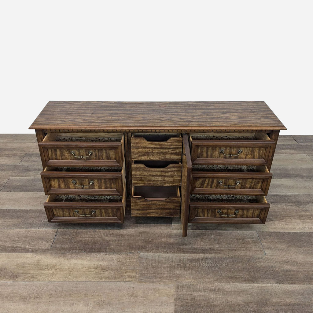 a vintage wooden desk with drawers on a wooden floor.