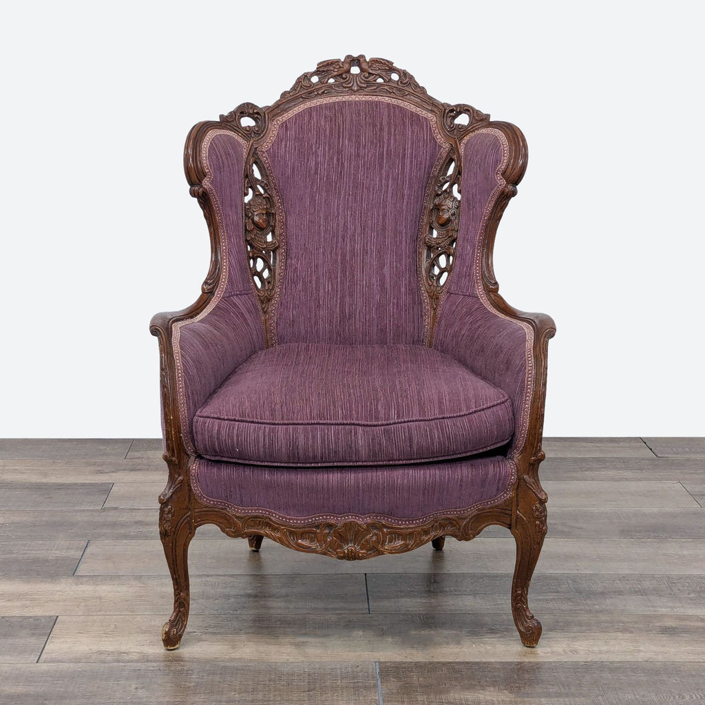 a purple velvet upholstered chair with carved wood arms.