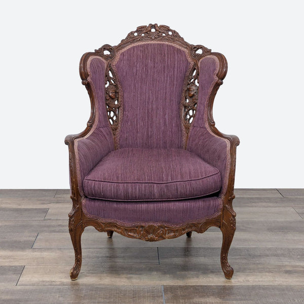 a purple velvet upholstered chair with carved wood arms.