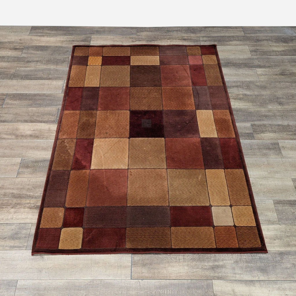 a brown and brown carpet with a square pattern on the floor.