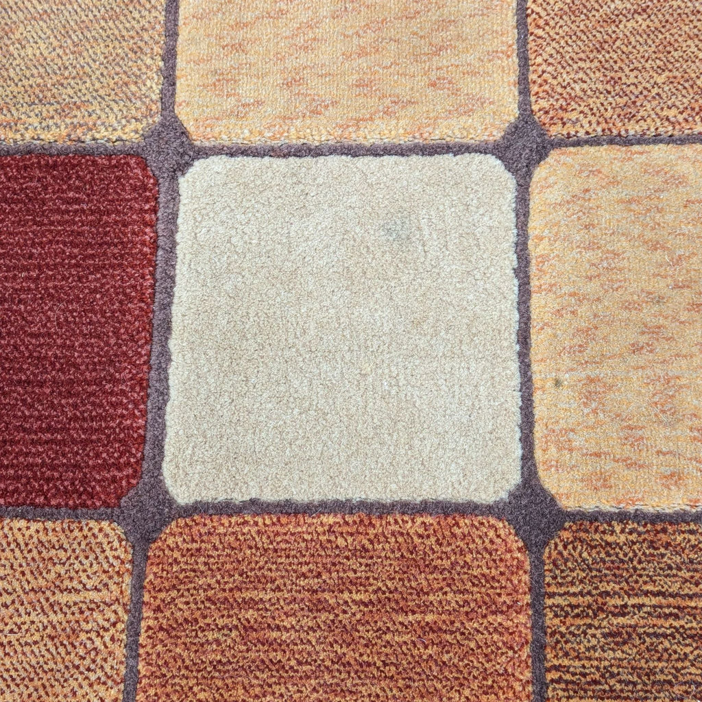 a carpet with a white square in the middle.