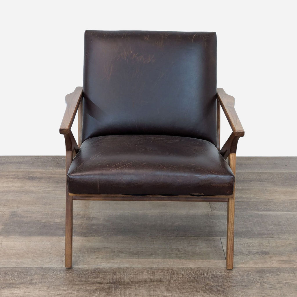 a pair of leather lounge chairs