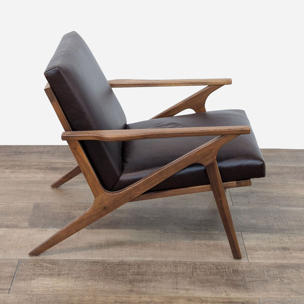 a leather lounge chair with a leather seat and a leather seat.