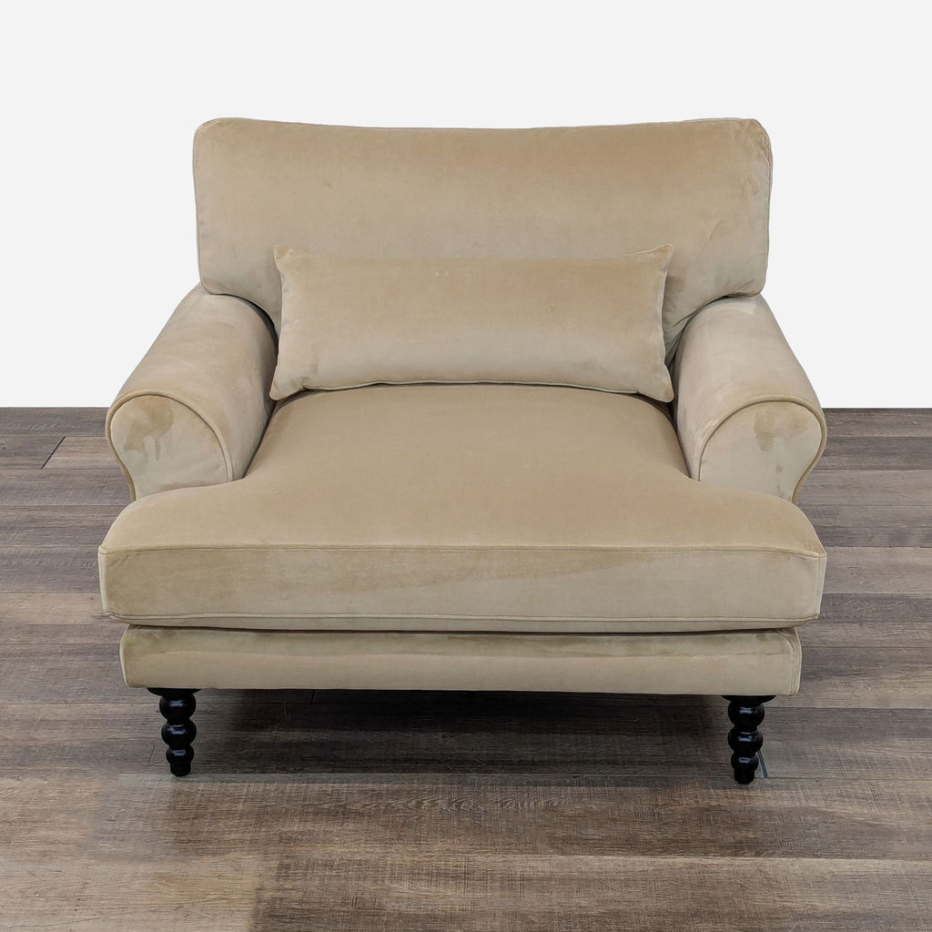 The Maxwell Lounge Chair by Interior Define, features velvet upholstery and turned wood legs, front view.