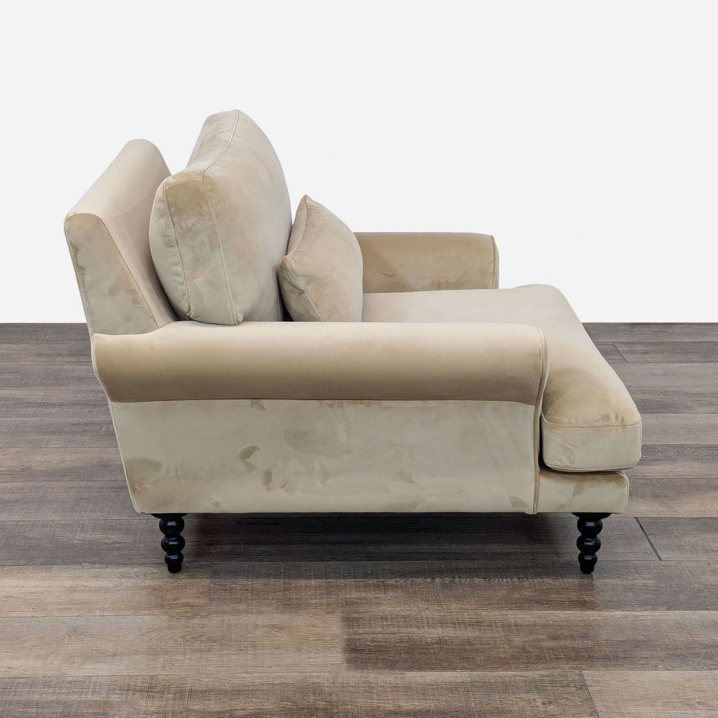 Side view of the Maxwell Lounge Chair by Interior Define, showcasing velvet upholstery and loose cushions.