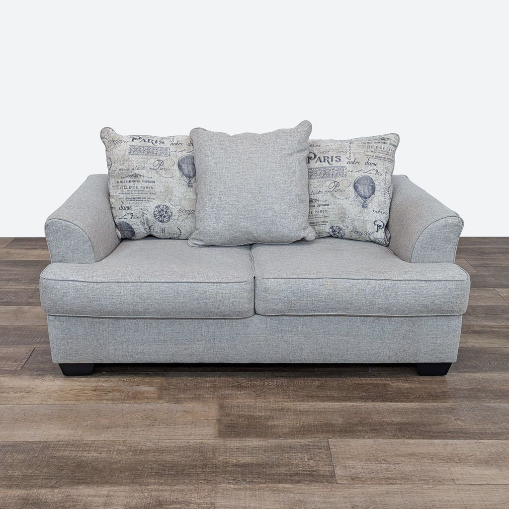 Front view of the Velletri loveseat by Ashley, featuring flared arms and neutral chenille upholstery.